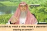 Is it shirk or kufr to watch a video that shows shirk or the presenter wears taweez?