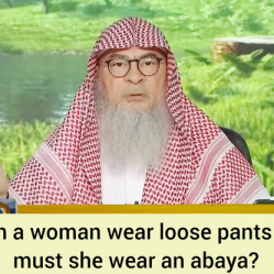 Can a woman wear loose pants & clothes or must she wear an Abaya?
