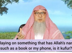 Laying on something that has Allah's name such as a book or my phone, is it kufr?