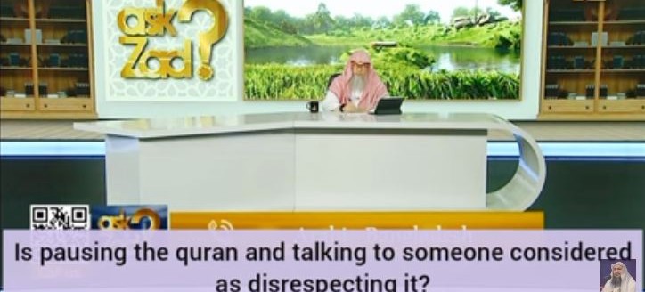 Is pausing Quran & talking to someone considered as disrespecting the Quran?