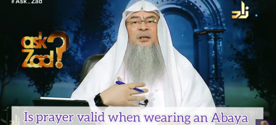Is my prayer valid if I wear an abaya covering over clothes that have images on it?