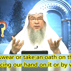 Can we swear or take an oath on Quran by placing our hand or by words?